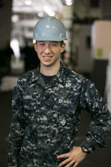 Seaman Zachary Gunkel is an interior communications electrician aboard the aircraft carrier operating out of Yokosuka, Japan. U.S. Navy photo.