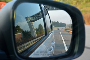 Rearview mirror during an early morning commute. 