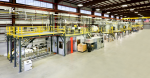 The Energy Department’s Carbon Fiber Technology Facility at Oak Ridge National Laboratory provides clean energy companies and researchers with the opportunity to develop less expensive, better-performing carbon fiber materials and manufacturing processes. Pictured here is the carbon fiber conversion line with the in-line melt spinner. The melt-spinner will be used to produce new precursor fibers that will then be converted to carbon fiber. In collaboration with industrial partners, these fibers will be used to produce prototype composite parts for applications, such as automotive parts, wind turbine blades and thermal insulation. | Photo courtesy of Oak Ridge National Laboratory.