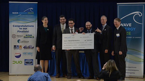 BETHESDA, Md. (Nov. 16, 2016) Team members for the Aqua Harmonics team from Portland, Oregon, receive first place in the Wave Energy Prize at a innovation showcase at Naval Sea Systems Command Cardarock, Md. The Wave Energy Prize was an opportunity for people across the nation to create new and innovative ways to harvest wave energy and do it at an affordable cost to product ratio. U.S. Navy Photo by Petty Officer 2nd Class Heath Zeigler.