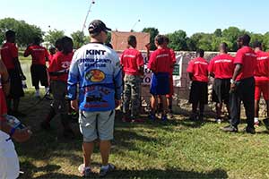 Young men prepare to head to the pond for some fishing.