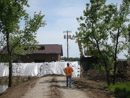 Construction of a berm to protect the Mni Wiconi Rural Water System raw water pump station. June 2011.