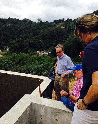 Deputy Assistance Administrator Mike Shapiro talking with Harvey Minnigh, Cristina Maldonado (CEPD), and Graciela Ramirez (CECIA-InterAmericana) about the progress of the construction of a filter for the community of Mulas Jagual in Patillas, Puerto Rico.