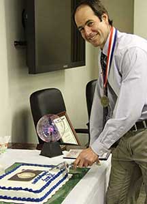 Grant Harris cuts cake