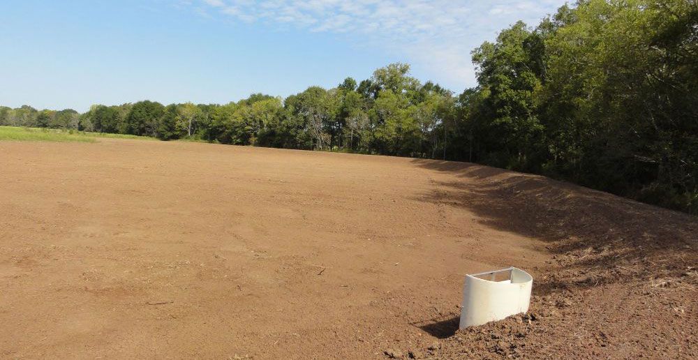 A former agricultural land as an empty dirt field