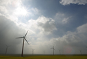 Wind turbines spread across a landscape.