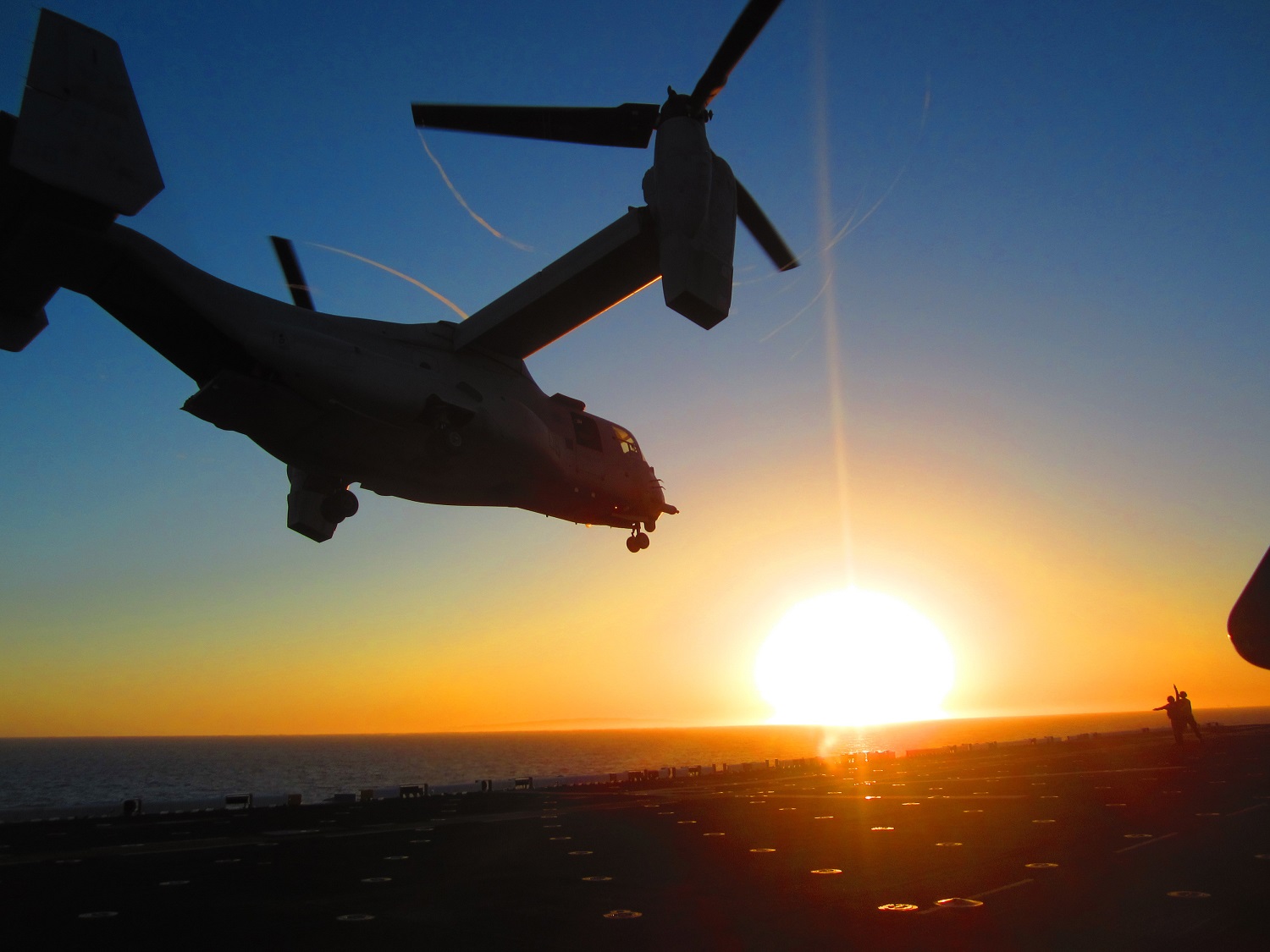 PACIFIC OCEAN (April 27, 2015) An MV-22 Osprey tilt-rotor aircraft from Marine Medium Tiltrotor Squadron (VMM) 163 lands aboard the amphibious assault ship USS America (LHA 6) during deck landing qualifications. America is the first ship of its class and optimized for Marine Corps aviation.  U.S. Marine Corps photo by Chief Warrant Officer 4 Shane Duhe 