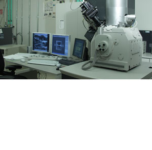 Photo of scientific equipment and computer monitors in a laboratory setting.