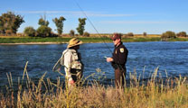 Federal Wildlife Officer checks fishing license.