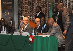 COTONOU, Benin - Brigadier General Guys-Pierre Garcia, the lead planner for the Economic Community of Central African States (ECCAS) delegation, co-signs a Communique along with the Economic Community of West African States (ECOWAS), to recommend that the Memorandum of Understanding (MOU) and Operational Agreement be submitted to the respective secretariats for eventual adoption by the states. The signing took place March 29 during the ECCAS and ECOWAS Maritime Safety and Security Conference in Cotonou, Benin, March 26-29, 2012. More than 250 representatives from more than 20 African nations attended the conference, which was held to facilitate cooperation between both African communities in order to provide regional maritime security in the Gulf of Guinea. The event was organized and facilitated by U.S. Africa Command and Africa Center for Strategic Studies.   (U.S. AFRICOM photo by Adam Gramarossa)