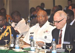 COTONOU, Benin - Ambassador William Bellamy, director of Africa Center for Strategic Studies, and Major General Charles Hooper, U.S. Africa Command, listen as (not pictured) Rear Admiral E.O. Ogbor, chief of Training and Operations, Nigerian Naval Headquarters, reads a Memorandum of Understanding during the Economic Community of Central African States (ECCAS) and Economic Community of West African States (ECOWAS) Maritime Safety and Security Conference held in Cotonou, Benin, March 26-29, 2012.  More than 250 representatives from more than 20 African nations attended the conference, which was held to facilitate cooperation between both African communities in order to provide regional maritime security in the Gulf of Guinea. The event was organized and facilitated by U.S. Africa Command and Africa Center for Strategic Studies. (U.S. AFRICOM photo by Staff Sergeant Olufemi A. Owolabi)