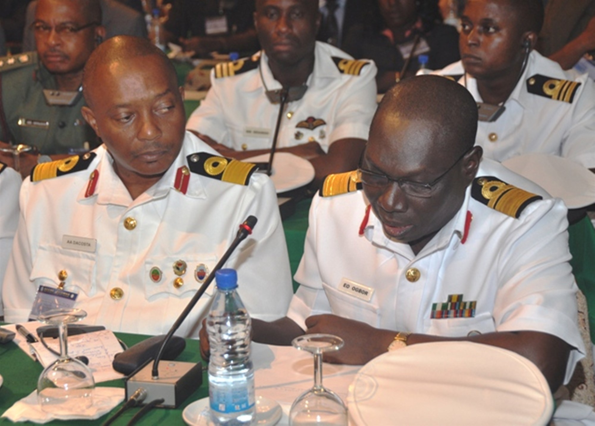 COTONOU, Benin - Nigerian Navy Rear Admiral E.O. Ogbor, chief of Training and Operations, Naval Headquarters, reviews a Memorandum of Understanding while other delegates look on during the Economic Community of Central African States (ECCAS) and Economic Community of West African States (ECOWAS) Maritime Safety and Security Conference held in Cotonou, Benin, March 26-29, 2012.  More than 250 representatives from more than 20 African nations attended the conference, which was held to facilitate cooperation between both African communities in order to provide regional maritime security in the Gulf of Guinea. The event was organized and facilitated by U.S. Africa Command and Africa Center for Strategic Studies. (U.S. AFRICOM photo by Staff Sergeant Olufemi A. Owolabi)