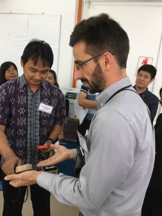 Participant from Indonesia engages IAEA expert in practice of a detector used in routine pre and post-visit monitoring. 