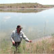   Refuge Complex Manager Jude Smith monitoring salt cedar trees that have grown up in the last year due to increase in water levels at Upper Paul’s Lake (saline lake)./ USFWS 