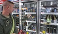 Army Spc. Kevin Alexander of 138th Quartermaster Company grabs an energy drink at the Post Exchange. Most energy drinks contain anywhere from 70 to 200 milligrams of caffeine. The daily recommended intake of caffeine is no more than 300 milligrams. (U.S. Army photo by Sgt. David Bruce)