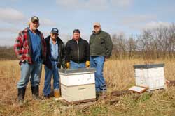 Joining efforts to build the bee population and crop production in Nodaway County are (from left) Kevin Helzer, Byron Miller, Mike Burch and Ray Werner.