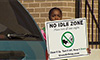 Photo of a child standing next to a vehicle and holding a sign that says 