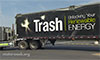 Photo of large trailer truck with text painted on the side that says Trash, Unlocking Your Renewable Energy