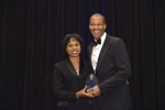 Director Dot Harris presents Chris Smith, Principal Deputy Assistant Secretary and Acting Assistant Secretary of Fossil Energy, with a professional achievement award at the Black Engineer of the Year Awards conference this February. Photo Credit: Nancy Jo Brown/106FOTO