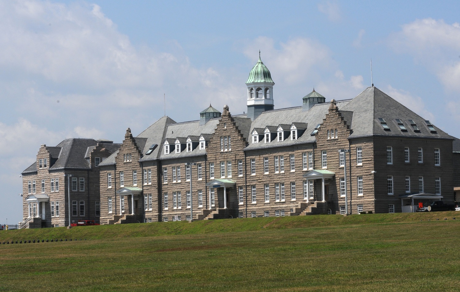 NEWPORT, R.I. (July 30, 2015) U.S. Naval War College's (NWC) Luce Hall located at Naval Station Newport in Newport, Rhode Island. Named after NWC's first president, Rear Adm. Stephen B. Luce, Luce Hall was built in 1892 and is a national historic landmark. Luce founded NWC's study of strategy, tactics, and operations based on a core of history. His lectures, readings, and seminars transformed from a month-long course to an intensive one-year professional naval study. Luce Hall now houses NWC's Naval Command College and College of International Programs. U.S. Navy photo by Haley Nace 
