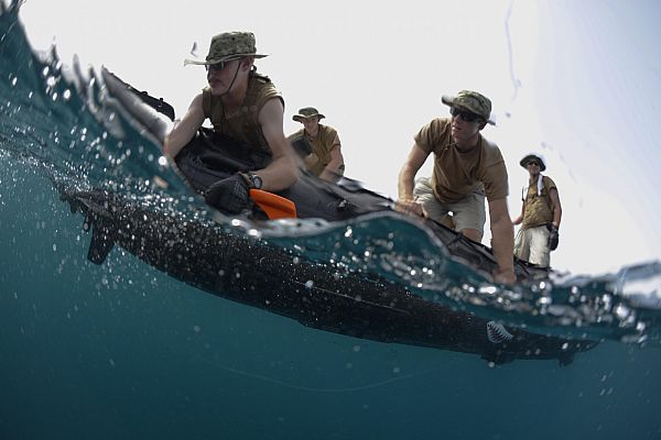 U.S. 5TH FLEET AREA OF RESPONSIBILITY (May 18, 2013) Aerographer's Mate 3rd Class Joshua Smart and Aerographer's Mate 2nd Class Duston Brashears, both assigned to the Naval Oceanography Mine Warfare Center at Stennis Space Center, Miss., lift an unmanned underwater vehicle out of the ocean following a mine training exercise during the International Mine Countermeasures Exercise (IMCMEX) 2013. IMCMEX 13 includes navies from more than 40 countries whose focus is to promote regional security through mine countermeasures operations in the U.S. 5th fleet area of responsibility. U.S. Navy photo by Mass Communication Specialist 1st Class Gary Keen.