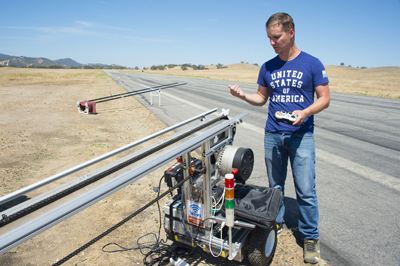 NPS alumnus Lt. Ray Davis, co-designer of the automated multi-plane propulsion system, monitors an unmanned aerial vehicle (UAV) launch during a field exercise at Camp Roberts, Aug. 27. Photo courtesy of NPS.