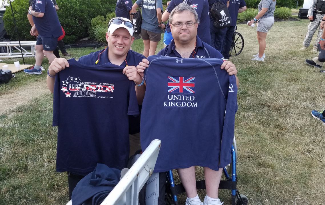 Hospital Corpsman 1st Class Shane Gilley, left, and a British competitor bond at the 2016 Department of Defense Wounded Warrior Games.