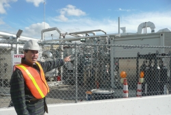 Professor Jack Brouwer, Associate Director and Chief Technology Officer of the National Fuel Cell Research Center, points out the tri-generation facility that uses biogas from Orange County Sanitation Districtâ€™s wastewater treatment plant to produce hydrogen, heat and power. | Photo courtesy of the Energy Department.