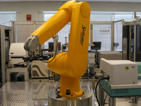 Robotic arm moving samples for screening