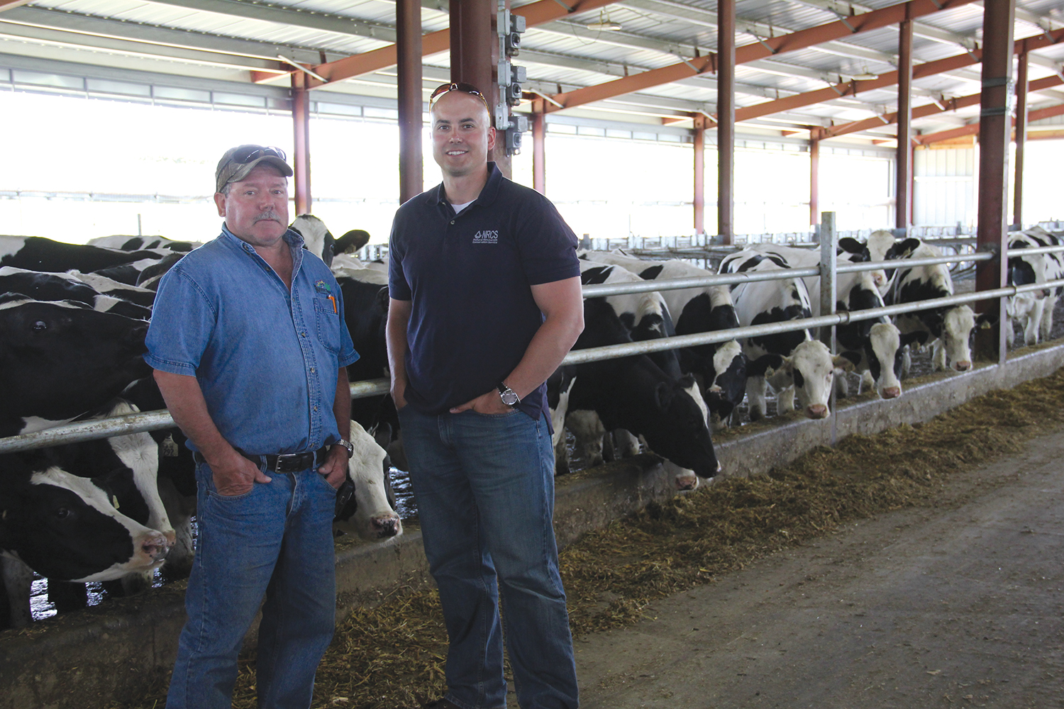 Joe and Ron in a heifer facility.