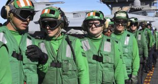 Sailors aboard the aircraft carrier USS Carl Vinson (CVN 70) await orders during a mass casualty drill on the flight deck. (U.S. Navy photo by Chief Mass Communication Specialist Amanda Dunford/Released)