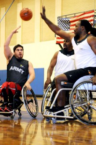 (From Left) Retired Army Spc. Juan Soto, a veteran of Operation Enduring Freedom, retired Army Sgt. Charles (Chuck) Allen, formerly stationed at Fort Hood, Tx., and retired Army veteran Spc. Anthony Pone, scrimmage during a wheelchair basketball practice at the U.S. Air Force Academy in Colorado Springs, Co., on 24 April, 2012. These athletes are joined by dozens of other wounded, ill and injured Soldiers and Army veterans selected to compete in the Warrior Games beginning April 30, 2012. (U.S. Army photo by Cpl. Kyle Wagoner, 43rd Public Affair Detachment)