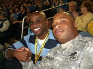 AW2 Veteran Ira Brownridge Jr. enjoys a sporting event with his AW2 Advocate, Melvin Kearney.