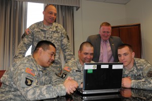 (left to right) Staff Sgt. Julio Larrea, Col. Johnny Davis, Staff Sgt. Jeffery Redman, Mr. Thomas Webb and Spc. Joshua Budd engage with the public during Tuesday’s Facebook Townhall. 