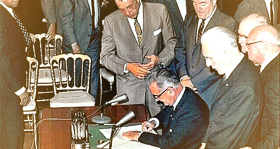 President Johnson signing Title VI in 1964