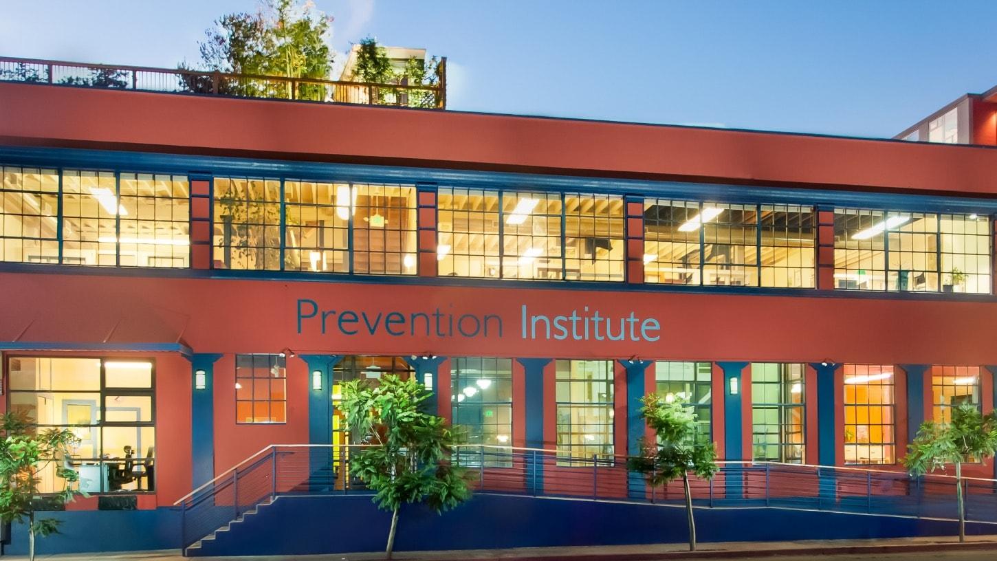 Exterior of the Prevention Institute building at dusk