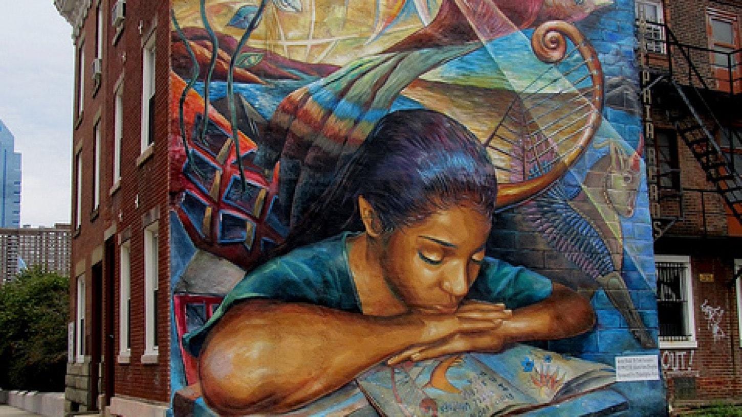 Mural of a girl reading