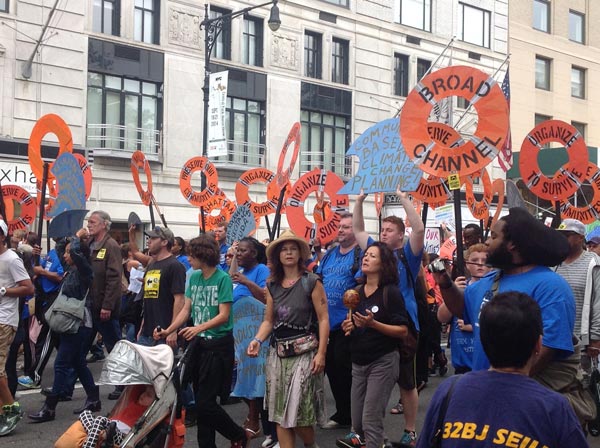 NYC residents affected by Superstorm Sandy call for action at last year’s People’s Climate March.