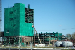 Workers remove panels from the Metals Plant in September 2012.
