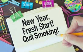 Notepad that says New Year, fresh start! Stop smoking!