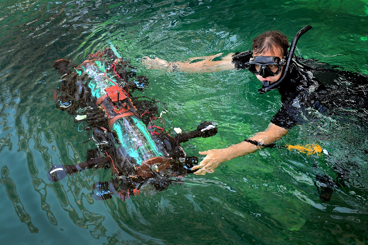 SAN DIEGO, (July 28, 2016)  A US Navy diver helps the Cornell University, Ithaca, New York, vehicle to enter the water at the19th Annual International RoboSub. Photo by Alan Antczak/Released