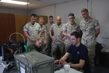 U.S. Marines with 1st Maintenance Battalion, Combat Logistics Regiment 15, 1st Marine Logistics Group, 1 Marine Expeditionary Force, learn from Mr. Nick Mazurek with Inventor Cloud, Applied Systems and Technology Transfer, as he talks about the software to use with an Invent3D printer during a hands on training class on Camp Pendleton, CA., March 30th, 2016. The hands on class is part of the Expeditionary Manufacturing Mobile Test-Bed Project which is a prototype mobile facility designed to support the continuous experimentation of advanced manufacturing tactics, techniques and procedures under actual operational or combat conditions. Marine Corps photo by Sgt. Rodion Zabolotniy, Combat Camera 