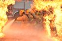 Air Force firefighters rush into extreme temperatures to extinguish a fire during training at the 165th Airlift Wing in Garden City, Ga., Oct. 3, 2015. Firefighters from the 165th AW train to meet local and global protection needs, provide timely fire prevention education and protection to the wing, the Air Dominance Center and the airport tenants. (U.S. Air National Guard photo/Staff Sgt. Noel Velez)