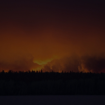 A massive wildfire rages Wednesday evening, May 4, 2016, near Fort McMurray. 