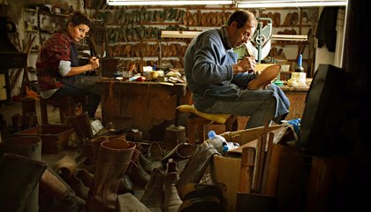 Shoe maker working in a 
unorganized enviorment and chaotic work. 