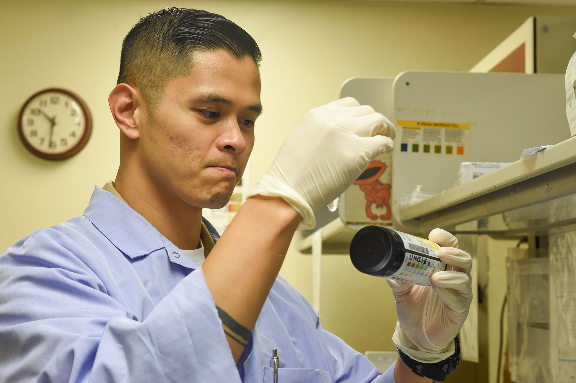170107-N-CF658-025 (Jan.7, 2017) Hospital Corpsman 1st Class Oliver Arceo thoroughly examines a urinalysis sample to detect proper kidney function at North Island Branch Medical Clinic onboard Naval Air Station North Island, Coronado, Calif. A former active duty corpsman and now a reservist, Arceo spilts his time between being a USNR Hospital Corpsman and Clinical Lab Scientist in San Diego. (U.S. Navy photo by Mass Communications Specialist 2nd Class Amanda A. Hayes/Released) 