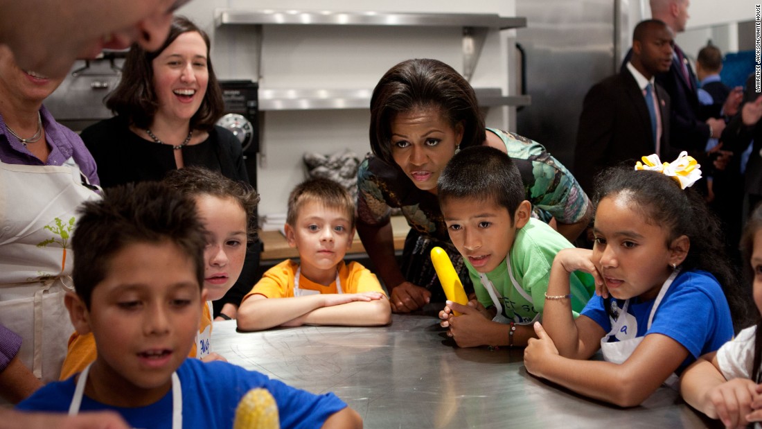 The first lady attends a chef&#39;s demonstration with third-grade students from Pocantico Hill School and John F. Kennedy Magnet School, before a luncheon at Blue Hill Farm in Pocantico Hills, New York, in 2010. 