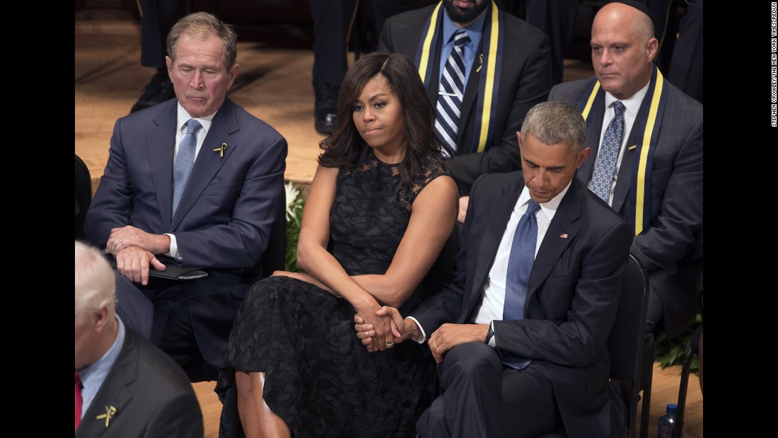 The Obamas sit next to former U.S. President George W. Bush at a memorial service in Dallas for the&lt;a href=&quot;http://www.cnn.com/2016/07/08/us/philando-castile-alton-sterling-protests/index.html&quot; target=&quot;_blank&quot;&gt; five police officers who were killed&lt;/a&gt; during a protest on July 7, 2016. Obama said that the nation mourned along with Dallas, but he implored Americans not to give in to despair or the fear that &quot;the center might not hold.&quot;