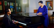 'A special visitor today in the Gershwin Room: #GershwinPrize winner Smokey Robinson plays a tune on George Gershwin's piano for Librarian of Congress Carla Hayden. Photo by Shawn Miller'