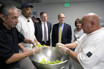 Secretary Perez speaks with veterans employed at Connections Housing in San Diego.